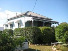 20 Chubb Street, One Mile, QLD Appealing character home. Dwelling features open front verandah, 3 
generous bedrooms, formal lounge with pot belly stove, separate dining, 
polished floors, 10ft ceilings, modern kitchen with bench space. No 
flood. Currently tenanted the home requires maintenance work, which 
will greatly enhance the property. Allotment 542m2. Bus transport at 
the door. Walk to Primary school and local shops. Ipswich CBD, 
university, Riverlink shopping complex some 6-8 minutes away by vehicle.
					 