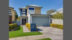  61 Wynnum North Rd Wynnum QLD 4178 Stunning Quality Lifestyle Home With Bay Views - INSPECT THIS SATURDAY AT 11.00AM This ex-Endeavour prize home will certainly impress. Across the upper floor you will find the main living and dining space, designed around an open plan layout which incorporates the sleek modern kitchen that opens out through bi-fold doors to the rear deck with views overlooking Moreton Bay. Step down to the lower level to the generous size media room/rumpus room that opens through bi-fold doors to the lower rear deck. Under the deck you'll find a 7000 litre water storage bladder. Five generously proportioned bedrooms each with built in robes, 2 bedrooms upstairs and 3 bedrooms downstairs.  Large bathrooms with spa bath Ducted air-conditioning on the upper level  Huge amount of storage space Vacum Maid, security system, intercom  Minutes' walk to train station, schools and Primrose Park Neatly manicured low maintenance yard  Owner needs to downsize! Will consider all reasonable offers. 