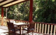  1302 Kennedy Hwy Kuranda QLD 4881 PRICE REDUCED!!! Vendors serious about selling, bring all offers! House - Property ID: 704258 Lifestyle and Privacy!!!! A beautiful, large, neat 4 bedroom pole home nestled in the rain forest, surrounded by bird life, with beautiful views of the rain forest canopy from the large front deck. Commanding views of the bubbling stream and lush gardens are abundant.  The home is nestled on just over an acre of land, has fabulous privacy and yet is only 5 mins to the center of Kuranda and 20 minutes to Cairns.  The home has four extra- large bedrooms with wardrobes in three. Large bathroom and separate toilet. Entry is through two solid timer doors into a Large lounge with formal dining and renovated Kitchen. Floors are polished hardwood timber throughout the home. It has raked ceilings with exposed beams .  Views are abundant from each window and most aspects of the home. Underneath the home there is space for parking of 3 vehicles and there is also a large undercover secured work shed area. This area would also be suitable for enclosure (STCA) should you need additional living areas or a granny flat. This home represents exceptional value, the first to see will purchase........ Inspections are by appointment.  Print Brochure Email Alerts Features  Land Size Approx. - 4 m2 