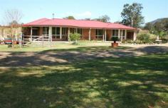  10 Irrawang Rd  Gloucester NSW 2422 The ultimate hobby block right on the edge of town. You can sit on the verandah of this masterbuilt 4 bedroom home and watch the cattle or horses graze around the lush paddocks or drink at the huge dam. The house features open living areas with views, walk in pantry, ensuite, built-ins, wood fire and large verandah area. The 140 sq mtr shed has 3 phase power, concrete floor, and a double carport at the front. Nearly 17 acres in size, it is capable of being subdivided or just build a second home for the extended family. You will love the location, the house, the sheds and the rural feel. 