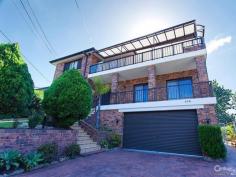  Lindfield NSW, 2070  DOUBLE BRICK MANSION - VIEWS - KILLARA HIGH Large mansion, built to last with good FUNG SUI. Double brick & concrete slabs, high ceilings, ducted central vacuum & R/C air cond, security alarm.  Within walking distance to Village shops, Beaumont Road Primary school, Killara High school bus at street corner, bus to station, to Chatswood & Macquarie Uni & shopping centres.  Generous formal living & separate dining rooms.  Large gourmet gas kitchen overlooking to back verandah, alfresco entertainment area, level backyard & fenced pool. Black granite bench top with stainless steel appliances.  Spacious casual dining, separate family room, open fire place.  5 bedroom + study + self-contained granny flat, 4 beautiful bathroom, large auto lock-up garage, ample storage.  Ground floor has 1 large bedroom with en-suite & 1 separate study/office.  master suit with parent's retreat, walk-in robe & en-suite.  Sparkling fenced pool, sun-filled alfresco bbq area, level backyard.  Upstairs has another expansive alfresco entertainment/games & gym area with pleasant surrounding views.  