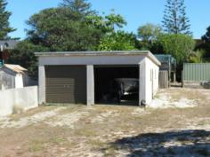  7 Manning St Manning Point NSW 2430 This is a rare opportunity to purchase a fully serviced building block centrally located at Manning Point. 
The block is situated one street back from the main street and within 
easy walking distance to the beach, river, Bowling Club and shop. 
The block has an area of 445m2, is fully serviced and improvements include a double lock up garage 