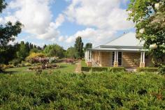 454 Rouse Street Tenterfield NSW PERFECTION - Peaceful Tree Change.
 
 $499,000.00 
 Close to the famous Tenterfield Golf Club, this exquisite quality 
built sandstone block home is set on 2.2 glorious acres surrounded by a 
beautiful and secret garden on the edge of town. This masterpiece has 87
 square metres of verandah wrapped around the home taking full advantage
 of the elevated position with terrific views. The tastefully 
designed home features 4 spacious bedrooms with built ins; main with 
ensuite, a country style New Guinea Rosewood kitchen, dining and lounge 
room with central wood heating, plush bathrooms and large laundry. This
 classy home possesses a contemporary design with a flare of elegance 
featuring quality finishes including decorative plaster cornices, 
colonial architraves and windows, dado rails and solid brass hardware 
throughout. The well thought out garden features a beautiful fishpond
 with waterfall, bearing fruit trees, 120 roses and a huge variety of 
cool climate trees and shrubs. To help with the maintenance in the
 garden there is a licensed bore with electric submersible pump with an 
extensive drip irrigation system to the whole block. Double garage 
with remote door and internal access, and a large colorbond shed with 
power, phone, toilet facilities and ample workshop space. This property has plenty of room to conduct a home business.
 