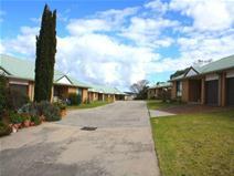 107 Martin St Tenterfield NSW 2372 The 12 unit brick complex located in an elevated position on the East side of town is up for sale. There are 4 two bedroom units and 8 three bedroom units all with their own single car garage with internal access. All insulated units include a modern open plan kitchen, dining and lounge room with wall heaters, generous bathrooms with spacious shower and own laundry. These units are situated on a 5883m2 block, have 3 titles and is an investment which will make a good return with current tenants mainly long-term. There is a communal BBQ area for residents and a maintenance garage and facility for the gardeners or caretakers. Inspections are highly recommended with adequate notice to give to the residents of this prime investment. 