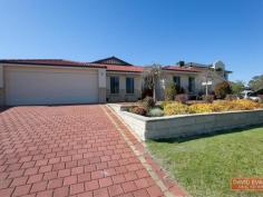  14 Hoskin Way Baldivis WA 6171 The words 'quality' and 'taste' immediately come to mind upon entering this comfortable West facing 4 bedroom property built on a private elevated site on the Tranby School side of the Settlers Hills estate. This property is bigger than it looks like from the outside. To the front there's tinted glass for privacy and heat deflection into the study and the master bedroom whch has a walk in robe and en-suite bathroom with elegant curved shower. The study is located next to the formal lounge and then leads into the L-shaped main living area flowing into the relaxing rear games room or 3rd sitting room. The large neutrally finished chefs kitchen has breakfast bar, walk-in pantry, large fridge space with plumbing for your water/ice cube maker, dishwasher, gas stove, mid level electric oven and access through to the double garage. Bedrooms 2,3 are good sized double bedrooms with bedroom 4 the size of a second master and walk-in robe overlooking the attractive back garden. Bathroom No.2 is tastefully finished in a travertine coloured glossy tile. You'll love the easy care back garden with lemon, lime and orange trees, raised beds and just imagine relaxing away from it all under the large patio. Other features include RC Air Con, Solar Panels, Gas Storage Hot Water, Retic, Alarm and video intercom entry system. This property is as good as they get and priced to sell - Do Not Delay. Viewing by appointment - It is better than the photos ... first come first served. 