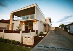  Thirroul1, NSW 2515 Contemporary ground floor garden villa of large proportions, featuring 3 oversized bedrooms, ensuite with dressing room to master, separate study. Features quality finishes; stone bench tops, chefs appliances to kitchen and reversed cycle air conditioning throughout. This home has open living areas that flow onto a huge private and covered alfresco entertaining area for relaxed indoor / outdoor living. A jumbo sized double garage and lush landscaping completes this fine property. A unique single level sanctuary of style and sophistication that offers light filled space with privacy, within minute’s level walk to patrolled beaches, pool, village and station. 