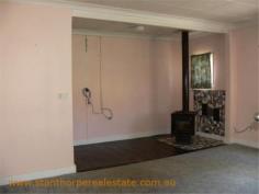  22 Granite St Stanthorpe QLD 4380 $185,000 4 bedroom low set residence Separate lounge Country style kitchen with gas stove & wood stove with wet back hot water system Modernized bathroom with shower Wood burning fire box  Large carport at rear plus a store room Rental? - $240 per week return Iron roof, rendered exterior, town water & sewerage Fully fenced ¼ acre allotment handy to town CBD and Quartpot Creek parklands This is a sturdy home with plenty of space and in a handy position. Category House Property ID H2999 