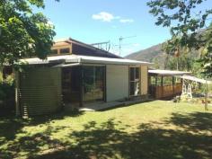  298 Huonbrook Rd Huonbrook NSW 2482 $419,000 Surrounded by lush rainforest and organic fruit trees, this house built with such care and pride has come on to the market for the first time. Part of a Council Approved M.O, this easily accessible 7.5 acres is part of a larger 98 acres with 8 other land parcels.  Features include:  2 Bedrooms  2 Bathrooms  Artists studio  Covered verandas  Above ground pool  Lush gardens For inspections, please call Dave Bosselmann on 0431 100 097 or Russell Siwicki on 0419 627 109. Features General Features Property Type: House Bedrooms: 2 Bathrooms: 2 Land Size: 3.04ha (7.50 acres) (approx) Indoor Toilets: 2 Study Floorboards Broadband Internet Available Open Fireplace Outdoor Balcony Deck Outdoor Entertaining Area Eco-friendly Solar Panels Solar Hot Water Water Tank 