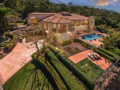  17 Coralcoast Drive Tallai, QLD 4213 Offers over $1,295,000 Huge Family Estate with Gold Coast Skyline Views House - Property ID: 757446 5 BED, 4 BATH, 2 STUDY, 6 CAR, POOL, LAND 5,632m2 WARMTH, SOPHISTICATION and commanding an exceptional street presence, this stunning luxury acreage estate provides the ultimate family home with extraordinary proportions, magnificently high ceilings and sweeping vistas of the gold coast skyline. Wrapped in terraces and decks, this grand home enjoys elegant entertaining areas for every occasion, formal living flows to relaxed over-sized family entertaining areas with floor-to-ceiling glass that flow freely to the surrounding decks taking full advantage of the shimmering panoramas and spectacular views.  A lower level games room gives breadth to a family living environment offering easy access to the sparkling in ground pool. The home's accommodation is delivered through, five generous bedrooms positioned separately and away from the entertaining portion of the home and provides peaceful havens to rest and restore. The generous master embraces absolute privacy with unsurpassed style and elegance including deep spa and terrace access. Second, third and fourth bedroom are truly generous in size with built-in robes, while each of the bathrooms are fresh and private.  The spacious and inspiring office is perfectly located and will surely please. A double driveway includes triple garage, massive workshop with internal storage plus rare gated side access for more vehicles / boat / caravan or extra useable land surrounded by manicured grounds. Available for private viewings over the Christmas holidays. Features include: . A Timeless and Gracious residence with a floor plan of 647sq m  . Wide wraparound balcony captures uninterrupted Gold Coast Skyline Views . A Grand double height Foyer . Spacious interiors feature elegant formal and casual living . High ceilings throughout . Games room on the lower level with full wet bar leading to paved patio . Inviting sparkling in-ground swimming pool with entertaining area . Master suite with a deluxe en-suite leads to terrace and private spa . Spacious and inspiring home office . Five king-size bedrooms, four private bathrooms with powder room  . 3 garage auto entry with internal access with 11.6 x 6.7 workshop . Stunning terraced grounds and manicured gardens with level lawns . Double driveway with Triple automatic garage and rare side access for more vehicles / boat / caravan or extra useable land  A statement in class and sophistication and represents a once-in a-lifetime opportunity to secure this gracious residence on approx 5,632m2 in a premier location with only minutes to main stream shopping, caf society and schools - Don't miss this opportunity!  Print Brochure Email Alerts Features  Land Size Approx. - 5632 m2 