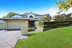  18 Canada Pl Arundel QLD 4214 $1,160,000 A home which radiates style, warmth and beauty. This is one of those properties you'll love to come home to after a long day. Not only does it have room for all the family it is also cosy and inviting. A stunning property located in one of Arundel Hills best streets, lined with trees that burst into a sea of white blossoms in spring (just beautiful). Backing onto the Arundel Hills Country Club you will never be built out, just sit back relax with your favourite drop and watch the players putt on the 16th green. This is not just a golf course but a boxing ring for your local Kangaroos too! That's right you will always be entertained. 5 Big bedrooms, 3 bathrooms all beautifully presented. A kitchen to die for it's all here, Miele appliances everything is soft close. A chef or cook's dream. This hub of the home is state of the art! Entertain on the big timber back deck while the kids frolic in the pool and Dad flips prawns on the BBQ, whilst watching his favourite football match on the big screen TV. Work from home, there is no need to leave the house with a big built in home office, which has everything you need to run a business. There is nothing to do here just move in put your feet up and wrap yourself in your luxurious surroundings. Close to schools, shops, transport even a short drive to the Broadwater.  -4 Big bedrooms upstairs -1 Ensuited guest bedroom downstairs -3 Bathrooms -3 living areas -State of the art built in home office -Pool -Ducted aircon upstairs / split systems downstairs -Manicured low maintenance gardens -This is not a gated community has no body corp Arundel is one of the most diverse residential suburbs of the Gold Coast, with everything from executive homes to townhouses.  This neighbourhood offers a wide range of developments including townhouses, villas, zero lot line homes, and middle to upper range single unit dwellings. Arundel has seen strong steady growth over the last five to seven years covering all styles of building, with strong buyer acceptance at all levels of the market - both in new and resale properties.  As a well-balanced area this trend will be even further strengthened with the continuing development of infrastructure in the area. Arundel Hills is where prestige properties can be found. This is a newer area than the wider Arundel suburb and homes here are all rendered, in accordance with stringent covenants.  Arundel residents are well serviced by a range of recreational and educational facilities. Bus links around the suburb offer good public transport for those looking to get to major Gold Coast centres, theme parks or the beach. Access to the community is bolstered by close proximity to the Gold Coast Highway and the Helensvale Rail Station.   Property condition 	 Renovated Property Type 	 House House style 	 Contemporary Garaging / carparking 	 Double lock-up, Auto doors (Number of remotes: 4), Off street Construction 	 Render and Hebel Joinery 	 Timber, Aluminium Roof 	 Concrete and Tile Insulation 	 Walls, Ceiling Walls / Interior 	 Gyprock Flooring 	 Tiles and Carpet Window coverings 	 Drapes, Blinds (Timber) Heating / Cooling 	 Reverse cycle a/c, Split cycle a/c, Ducted, Ceiling fans Electrical 	 TV points, TV aerial, Phone extensions, Rewired Property features 	 Safety switch, Smoke alarms, Vacuum system Kitchen 	 New, Designer, Open plan, Dishwasher, Separate cooktop, Separate oven, Rangehood, Extractor fan, Waste disposal, Breakfast bar, Microwave, Pantry and Finished in Granite and Lacquer Living area 	 Formal lounge Main bedroom 	 King, Balcony / deck, Walk-in-robe, Heating / air conditioning and Ceiling fans Ensuite 	 Spa bath, Separate shower Bedroom 2 	 Double, Built-in / wardrobe, Balcony / deck and Heating / air conditioning Bedroom 3 	 Double, Built-in / wardrobe, Balcony / deck and Heating / air conditioning Bedroom 4 	 Double, Built-in / wardrobe and Heating / air conditioning Bedroom 5 	 Double, Built-in / wardrobe and Heating / air conditioning Additional rooms 	 Office / study, Media, Family Main bathroom 	 Separate shower, Additional bathrooms Entrance 	 Double timber glass doors Family Room 	 Balcony / deck and Heating / air conditioning Laundry 	 Separate Views 	 Park, Private Aspect 	 North, East Outdoor living 	 Entertainment area (Covered, Uncovered and Other surface), Pool (Inground, Pebble, Salt and Security fencing), Garden, BBQ area (with lighting and with power), Deck / patio, Verandah Fencing 	 Fully fenced Land contour 	 Flat Grounds 	 Manicured, Tidy, Landscaped / designer, Backyard access Garden 	 Garden shed (Number of sheds: 2) Water heating 	 Electric Water supply 	 Town supply Sewerage 	 Mains Locality 	 Close to shops, Close to transport, Close to schools 