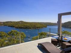  36 Gurney Cres Seaforth NSW 2092 $11,000,000 The Ultimate Harbourside Mansion This incredibly substantial and architecturally designed master built mansion and has been designed with extreme comfort, premium quality and luxury in mind while privately nestled amongst the trees on a double lot. Prominently positioned with almost 1000m2 of luxurious modern living across three levels. It is unsurpassed in design, quality and location. The beautiful surroundings are further embraced with 20-metre wide terraces on each of the three levels. The home offers spectacular 210-degree panoramic views of Middle Harbour from every level. The tranquil views of untouched waterfront reserves, secluded harbours and endless pristine blue waters create the impression that you are living in a private paradise, while being only 30 minutes from Sydney CBD, and just moments from Seaforth shops, restaurants, schools, parks, golf courses, and transport to the city and the popular northern beaches. - 2 Gourmet kitchens & one Kitchenette - Entertainment room and home theatre with home-wide audio system - Heated flooring, double sided gas fireplace - Fully approved three bedroom guest house - separate accommodation - Specially designed home gymnasium - Wine cellar - holding 1200+ bottles - C-Bus system with colour touch screen - Fully integrated security system with infra-red cameras - Sauna fully imported from Finland - Eco friendly BASIX Certified home - Glamorous infinity gas heated 11 metre wet edge pool with Jacuzzi and two spas - Koi fishponds, water features, landscaped grounds - Boat moorings and a fenced public sea pool in a waterfront reserve - Two street access Inspect by Appointment - Mark Clarke 0407 600 211 