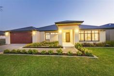  7 Conimbla Ln Aubin Grove WA 6164 Property Information Open Home Dates: Saturday 26 Sep 2:20 PM - 2:40 PM Sunday 27 Sep 2:20 PM - 2:40 PM FIXED DATE SALE ENDS 7th OCTOBER @ 4PM ALL OFFERS PRESENTED!! Magnificent in every sense, this luxurious residence is sure to impress. The property sprawls over a generous 608sqm block with multiple entertaining areas and lush landscaped gardens - taking family living and entertaining to a whole new level! First impressions offer perfectly manicured gardens and a grand facade leading to an impressive portico. Step inside to discover the most glamorous of family homes, where every detail has been carefully considered and realised with no expense spared.  A magnificent floor plan echoes the spacious allotment the home is set on with well-proportioned living areas, providing formal and casual designated spaces that span out to an equally impressive alfresco. Quality Spotted Gum timber flooring, high ceilings, beautiful colour schemes and rich finishes feature throughout the home, creating an allure that will not be denied. There is no shortage of space to ensure absolute comfort and convenience. This includes a sumptuous lounge/theatre room, large games room and a separate study or fifth bedroom, as well as the most impressive open plan living and dining domain encompassing the designer kitchen.  The centrally located modern kitchen will impress the fussiest of chef's, boasting state of the art appliances, banks of cupboards, Ceaser stone bench tops, overhead storage, induction cooktop, walk-in larder and large fridge recess. Server windows offer easy meal service to the alfresco making summer BBQ's and entertaining a breeze! There are four bedrooms offering the flexibility to accommodate the entire family and guests. All of the bedrooms are wonderfully sized with magnificent storage and stunning decor. This includes the lavish master room, complete with His and Her walk-in wardrobes and lavish ensuite featuring a double shower. The property is further enhanced by a separate powder room and laundry that is brilliantly equipped with intelligent storage solutions. Additional features include ducted reverse cycle air-conditioning, shoppers entry, LED lighting, security alarm, Crimsafe security doors, quality window treatments and a double lock-up garage with additional storage space and access to the rear yard.  Outside feels like an extension of the living accommodation with instant access to the fully paved alfresco - ideal for relaxation or simple family dining. The gardens are fully landscaped and reticulated and boasts a garden shed for extra storage.  Lifestyle and convenience are paramount with an abundance of parklands at your doorstep. Additionally, the property is very close to Aubin Grove Primary, the freeway, Transperth bus links, and close proximity to Cockburn Central and the upcoming Aubin Grove Train Station, making this place a well-connected family and commuter destination!  Please contact us for more information or to arrange a viewing. Property Type 	 House 