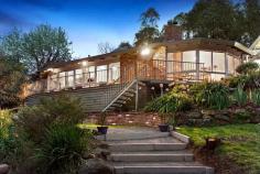  17 Kruses Rd North Warrandyte VIC 3113 $780,000 - $850,000 A Private Tree-Scape On A Breathtaking 1.6-Acre Haven Glorious in its refined simplicity in a location desired for its privacy yet convenient access to the heart of Warrandyte and Templestowe, this breathtaking family residence represents an escape from the hustle and bustle with a focus on harmonious family living. Less than a 40-minute drive into the CBD, city professionals can still enjoy an easy commute into the heart of Melbourne. In fact, not much is out of reach from this desirable location, with The Pines Shopping Centre, wineries of the Yarra Valley, Heritage Golf Club and the Eastern Freeway all within convenient access. When you return back to base, however, you'll feel a world away from the stresses of everyday life given the remarkable tranquility that envelops the sprawling 1.6-acre (approx.) property, which features plenty of open space for kids to explore and a charming walking path through the mature gardens. A chic character is born from the interior's minimalist design, with contrasting textures and tones, timber floorboards underfoot, open space and sun-kissed living areas contributing to the home's modern persona. Height and space in the stunning open-plan arrangement is accentuated by the striking angled ceiling that soars above; a tiered layout and alluring open fireplace also serve to 'zone' this vibrant hub without losing any real sense of intimacy. The lengthy family living, for example, occupies the lower level of the open-plan setting, set against a scenic backdrop of leafy panoramic views that can be enjoyed from the comfort of the adjacent entertaining terrace. Behind the open fireplace hides a peaceful study/home office that inspires creativity with its radiant nature and pleasant outlook, while a large dining area and cook's kitchen (with stone benchtops and quality appliances) enjoy pride of place on the upper level. Designed for family living, bedrooms are therefore zoned along a separate section and serviced by a family bathroom with a semi-frameless shower and bath. A private Master bedroom, meanwhile, enjoys the benefits of its own ensuite and walk-in robes. With so much outdoor space, you're spoiled for choice when it comes to selecting an area to relax and unwind. A peaceful courtyard nestled beneath a blossoming tree offers a desirable setting to enjoy your morning breakfast, and for larger gatherings, you have the option of putting the lengthy entertaining terrace to good use or dining beneath an open sky on the top of a hill with views across the property. Finished with evaporative cooling, gas ducted heating, paved cellar/storage area under the house, double carport and a second driveway for generous off-street parking for a caravan, boat or trailer, put your family first and make the 'tree-change' for the better. Features Ducted Heating Evaporative Cooling Study Floorboards Price Guide: ESR: $780,000 - $850,000   |  Land: 5,741 sqm approx 	  |  Type: House  |  ID #321347 