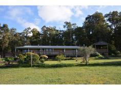  4 Johnston Road Nannup WA 6275 $559,000 Key Details property ID 449705 land size 9.39ac Description HILLSIDE HOME You can have it all with this country style home on 9.39 acres. Built in an imposing position on the large pastured block, you can relax by the fire and take in the valley views to one side, or gaze out into the forest from the other. The main house has timber floors and classic Australian wrap-round verandas, four bedrooms and two bathrooms. The large open plan family area features a cathedral ceiling and exposed beams. Through every window you have a sweeping pasture or bush scene. For outdoor entertaining there is a purpose built covered deck taking full advantage of higher ground. As well, there is a stone built cottage that has been converted into games area and a 9 x 6 metre shed to house the tractor and attachments. Water supply is taken care of by two rainwater tanks and a bore. This is a well set up property for country living backing onto state forest in the popular area of Jalbarragup 25 km south of Nannup. 