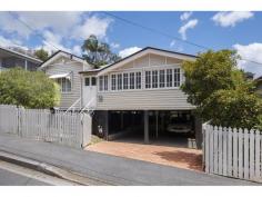  4 Scott St Red Hill QLD 4059 Key Details property ID 573483 land size 405m2 Description Character filled Queenslander in prestigious Red Hill This spacious residence is the epitome of easy Queensland living – brimming with charm, street appeal, attractive gardens and an abundance of off-street parking – all in a premier city location within walking distance of the CBD. Generously proportioned with three bedrooms, open plan living, and wrap around enclosed verandahs, this home offers a distinctive and relaxed alternative to “cookie-cutter” modern builds. Its charm lies in a wealth of sought-after character features including: decorative archways and ceilings, French doors, textured coloured glass windows, high ceilings, VJ’s, and polished timber floors. Well maintained and ready to move in, the neutral colour palette provides a clean fresh canvass with enormous potential to put your own designer stamp on the décor. There is ample opportunity to capitalise even further by updating the kitchen and bathroom to create a truly stunning contemporary feature home. The flexible floor plan also allows for the conversion of the current bathroom to an ensuite and the addition of a second bathroom adjacent to the rear sunroom. Offering gas cooking, air conditioning to the living area and 2 of the bedrooms, an alarm system for extra security and plenty of windows to catch the breezes, the city lifestyle on offer with this property is outstanding. Nestled on a fully fenced 405m2 low maintenance allotment with landscaped gardens and mature trees framing the front and back yards, the property also boasts a rare four covered carparks (two tandem side-by-side) and a handy downstairs laundry. With so much to offer in such a prime location, the potential to add value to this property represents both a great lifestyle choice and an exceptional investment. Located just 2.5 kilometres from the city centre – it’s an easy 30 minute walk, 10 minutes by bus or just a quick five minute drive to the heart of Brisbane’s CBD. The leafy suburb of Red Hill is home to a variety of cafes, restaurants, shops and a regular bustling farmers market. Quality schools, Universities, TAFE, Hospitals and sporting facilities are all within easy access. With land in this stylish city suburb destined to continue rising in value, there is also the option of ‘landbanking’ or purchasing for future residency, as there’s an excellent rental option with long-term tenants signed at $550 per week until November 2015. Whether you’re looking to secure a substantial home in a handy inner-city location or want to make an astute investment that capitalises on growing demand, this property should be at the top of your list! 