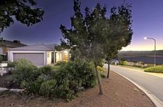  104 Hugh McKay Cres Dunlop ACT 2615 With a View to the Future! Auction to be held on Wednesday 16th March 2016 at 6:00pm, at LJ Hooker Canberra City, 182-200 City Walk. Whether you are starting your property portfolio or looking for the forever home, this one is a must see. Located in a sought after pocket of Dunlop, this property will make you feel at home from the moment you drive in your driveway! On an elevated corner position with views over the Brindabella's, you can sit back, relax and watch the sunset from your expansive entertaining deck.  The 3 bedroom floor plan has been converted into a 2 bedroom, 2 living area home. So you have the option of keeping the current floor plan or easily convert back to the 3 bedroom layout. Either way you will love the open plan kitchen and living design and the outlook onto the easy care gardens. The plants are established to maximize privacy but not have you in the garden every weekend.  Inside is beautifully presented with floating floors, a gas fireplace with ornate surroundings and evaporative cooling for the summer months! There is even a spa bath for unwinding in (after you have enjoyed the sunset from your deck and a glass of wine in front of your fire!), what more could you want?! How about motivated vendors and the fact that it is currently tenanted by fantastic house proud tenants, you can let them look after your home until you are ready to move in! Or talk to me about your moving timeframes. This home is a beautiful mix of class, style, easy care and of course luxury lifestyle, without breaking the budget! This property is unlike anything else on the market, so call today to inspect, you won't regret it!   Property Snapshot  Property Type: House Land Area: 366.20 m2 Features: Study Ducted EER: 4.5 