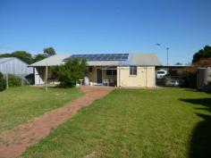  10 Edward St Meningie SA 5264 $225,000 DON'T JUDGE THIS HOME FROM THE OUTSIDE Property ID: 9445002 Vendor is keen to sell this furnished brick veneer home with 3.8kW solar systems on a Walk-In Walk-Out basis. This home is positioned on approx 1310 sqm with front & rear street access & consists of 3 bedrooms, main with Walk-in robe & ceiling fan, 2nd generous bedroom with ceiling fan & a single bedroom, bedrooms are carpeted & new bamboo floating floor in living areas, lovely new modern kitchen/diner, separate lounge with reverse cycle split system airconditioner, bathroom with shower, bath & vanity, separate toilet & large laundry. Outside is a 4 bay carport, 14m x 6m garage with attached workshop with concrete floor, 3-phase power & lighting & rainwater storage. Easy care, fully fenced large back yard. We highly recommend an inspection to see all of the work that has been done inside. Land Area 	 1,310.0 sqm 