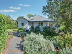  7/255 Witta Road Maleny QLD 4552 $549,000 Country style at Witta - Peace and Privacy Assured If you are longing for the look and feel of a Queenslander, without the work, you will love this beautiful home!  • 	 Beautifully renovated Queenslander set on 2916m2 block • 	 Fresh paint inside and out - sit back and relax.... • 	 4 light and airy bedrooms, main with walk in robe and ensuite • 	 Country style kitchen with plenty of cupboard space and servery to the verandah • 	 Stunning polished hardwood timber floors throughout and 10' ceilings,  • 	 All seasons catered for with a cosy wood fire burner and split system air conditioning • 	 Sunny North facing verandahs on three sides with new powder coated aluminum railings, no maintenance • 	 3 car accommodation under the house plus workshop area • 	 Extra high 6m x 9m carport for caravans or additional cars • 	 Easy care, low maintenance, landscaped gardens including a vege patch and abundance of fruit trees  Escape to the country and enjoy the time and effort already spent.  Call RE/MAX Hinterland to arrange your private viewing. This one is PRICED TO SELL and sell quickly it will! 