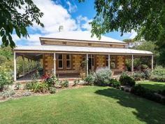  13 West Terrace Strathalbyn SA 5255 $769,000 An Ageless Beauty! Property ID: 9385752 Magnificently situated on Strathalbyn’s finest Terrace. A proud statement in elegance this circa 1917 stone home is a rare gem. Set in 2057m2 (approx) allotment the home has grand rooms with beautiful character features and an envious street presence.  First impressions are met with soaring ceiling heights of the entry hall, pressed metal ceilings with decorative roses. Original features continue through the home with polished timber floors, ornate fire places and leadlight. Modern conveniences such as split system and ducted r/c air conditioning, 5.25kW solar system, 44,000L rain water storage, insulation and amazing storage throughout. A seamless extension blends the old and new beautifully which has made this home completely flexible for any family to embrace the perfect lifestyle. Expansive accommodation of 4 bedrooms, main with ensuite and walk in robe and French doors, family bathroom and 3 toilets. Spacious living with stonemason designed open fireplace for maximum energy efficiency. Three French doors provide an inviting outlook to the rear yard. Very functional and large central kitchen with walk in pantry, dishwasher, smeg cook top, oven and direct access to the laundry. Opening from the generous living and dining area to the rear vine covered pavilion and hand built stone pizza oven ideal for entertaining. A well proportioned cellar is ideal for the wine connoisseur.  The manicured grounds with superb sprawling gardens provide a sense of grandeur and encompass the return verandah of the home. The heritage post and rail fence with iron gates securely encloses this yard and also provided access to the drive leading to the double garage and lean-to located at the rear of the property. This exclusive Terrace address is located a few minutes walk from the heart of Strathalbyn and also provides easy driving access to the city, river or beach.  Once in a generational opportunity to acquire for this historic and immaculate family residence. Land Area 	 2,057.0 sqm 