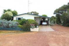  9 Banksia Cres Wongan Hills WA 6603 $269,000 You Need To Get Inside This Property From the outside this home does not reveal all it has to offer. The home has great street presence with a neat, tidy and well kept home and grounds. From your front porch you enter into the home where you have your office on the left side of the entry hall. Past the entry hall and into you open plan and vast lounge, dining and kitchen area which has ample room for a growing family. The laundry runs off the kitchen area which has room for a washer, dryer and storage, you have direct access outside from your laundry, the second toilet is in the laundry area as well. A family bathroom is located in the middle of the home for ease of access. All 4 bedrooms come off one wing of the home, with a hallway linking all the bedrooms, each of the 3 bedrooms are a very good size with plenty of room for beds, wardrobes and a study desk if needs be. The master bedroom is a treat, a generous sized room with large windows ensuring plenty of natural light, you have your ensuite complete with a spa bath and shower overhead. A large family/games room with a bar makes for many pleasurable hours of entertainment and fun. The grounds of the property have been well maintained and designed in a practical manner to ensure you get best use of the property. Along one side of the home is a lovely cool summer outdoor entertaining area which is brick paved and covered, you can imagine spending many hours in this space. The rear yard has a large veggie patch area a cement floored and powered workshop/garage, plus 3 rain water tanks. You have a 600 litre water tank for drinking a 5,000 and 1,000 litre water tanks which are used mainly for the gardens. You will find it hard to fault this property, ready to move into with a motivated Seller. We look forward to your inquiry. Property Details Elders Property ID: 10120081 4 bedrooms 2 bathrooms 4 car parks Land Area 910 square metres Car Parks: 1 Double garage Single carport Air Conditioning 