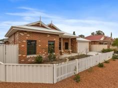  14 Tauman Loop, Guildford WA 6055 $665,000 - $679,000 Circa 2011. This light n’ bright 4 x 2 brick & iron home, boasting an innovative and creative floor plan affords plenty of room for the whole family and is nestled amongst quality homes. • 	 Picket fence, concrete driveway & veranda  • 	 Impressive hallway with French doors  • 	 Home Theatre  • 	 Private master bedroom with his n her walk in robe, superb ensuite with double vanity and separate wc  • 	 Fabulous kitchen with ample granite benchtops, cupboards galore!, stainless steel stove, range hood & dishwasher – lovely garden views.  • 	 Generous family room & dining room with alfresco views  • 	 Three additional roomy bedrooms (2 with walk in robes, 1 with built in robe)  • 	 Family bathroom complete with shower, bath & vanity  • 	 Separate wc  • 	 Well appointed laundry  • 	 Excellent storage  • 	 Large alfresco entertaining area under the main roof  • 	 Additional features: double garage with sectional door & shopping entrance for easy convenience, ducted evap air conditioning, easy care auto reticulated gardens, attractive timber laminated flooring to the living areas, quality carpet to the rest of the home.  block size 588m2. WALK IN & ENJOY! Evaporative Cooling Fully Fenced Outdoor Entertainment Area Remote Garage Secure Parking Built-in Wardrobes Dishwasher 