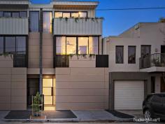  189 Princes StPort Melbourne VIC 3207 $1,850,000 - $1,950,000 Superb design and a magnificent interior are at the heart of this new rear north-facing town residence, where every luxury comes standard. Studio 35 Architecture has created a three-level home that excels with premium finishes and fixtures. The modern exterior reveals a wide entrance hall with two spacious ground-floor bedrooms one featuring a private landscaped courtyard and both bedrooms enjoying BIR’s and a central luxe sparkling bathroom. Up to the first floor, the living and dining spaces are either side of the high-end Corian kitchen, with Miele integrated refrigeration, two Vintec wine fridges, induction cooktop, and two ovens. Living room fitted with custom-designed entertainment unit with sliding doors opening to the balcony perfect for indoor/outdoor entertaining. Make your way up the timber staircase with concealed LED handrail lighting and arrive at the bespoke study area opening onto the north-facing terrace with breath-taking uninterrupted city views. The master bedroom retreat is positioned privately on the top floor. This zone is an everyday indulgence like no other, featuring clerestory timber-lined ceiling, pendant lighting and a state-of-the art ensuite. Watch the Spirit of Tasmania dock and depart from the front balcony. Be the first to call the spectacularly designed home yours with further highlights including, heated concrete and bathroom floors, each room with their own split system heating & cooling, matte black accents throughout the home for added sophistication, cleverly hidden laundry on the ground floor, secure home security system, planter boxes with self-watering system, ample storage and a remote garage. All of this just moments from Bay Street shopping precinct, Port Melbourne Beach and the Light Rail for easy CBD access. 