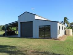  12 Bundesen Ave Midge Point QLD 4799 $230,000 The American Barn: * 10 x 10 mts, thermal sarking to some walls and entire ceiling. * Power & town water connected and also a small water tank. * Inside the barn is a double sink and an outside lean to shower cubicle. No toilet or septic. * A single carport and a smaller one to house the tractor slasher which comes with the property. * Set on a level 2.5 acre allotment with established mango trees. * Inside can be designed to accommodate a bathroom etc to make an ideal weekender.  The Area: Just a few minutes drive to Midge Point Beach, with tremendous fishing and crabbing.  The local tavern/bistro, post office and takeaway/general store is just a short walk away. A school bus services the area which travels to Proserpine and Bloomsbury Schools for all ages. Get back to nature but close enough to a cosmopolitan lifestyle. 15 minutes to Whitsunday Coast Airport, 1 hour to Mackay & Bowen and an easy drive for the mining sector. Airlie Beach 40 minutes and access to all Whitsunday Islands. 