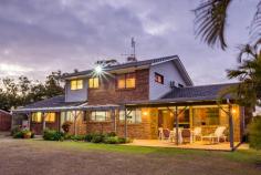  36 Langbeckers Rd, Thabeban QLD 4670 This magnificent grand residence offers a country lifestyle in a stunning picturesque setting, yet just 6.8km to Bundaberg’s CBD. Sprawled out over 2.5 manicured acres with quality drinking bore water, the well-designed split level layout provides a plethora of intimate areas, allowing the larger families to still find comfort in their very own space. The home’s grand north facing façade, grabs your attention from the roadside, as you enter via a large horse-shoe driveway. Designed to flow freely from space to space, the large kitchen complete with a walk-in pantry is very central, combined with a dining space, two massive living rooms showcasing a classy built-in liquor cabinet & a large formal dining, easily converted into a lower level bedroom. Easily accessible is the laundry, main bathroom & in through the single lock up garage, is your very own office space. The upper level hosts three very generous size bedrooms all with built-in cupboards, ceilings fans & the master with a/c. A separate built-in utility room, ideal for storage or as a private study room for the teenagers. The bathroom is large enough to throw a party, complete with a massive bath tub/shower & vanity. Heading outdoors, there is a tiled patio right the way across the back of the home for entertaining, a private setting with a beautiful bushland aspect across the back of the block. And not far from the residence, you will be able to accommodate any machinery, weekend toys or your everyday vehicles, in the 16m x 10m steel frame shed – with up to 8 secure spaces as well as a workbench. The rear of the block has some beautiful established trees, a nice place to walk the dogs of a summer evening. Embracing privacy whilst providing a quality lifestyle, this uniquely designed residence comes with all the extras needed for convenient acreage living. It will meet the needs of every family, no matter how big or small. With abundant living spaces focused on light, flow and openness, there is a place for everyone in the family to enjoy. With the owners ready to hand over the keys to their home, since they designed & built many years ago, a wonderful chapter of their life closes & a new one begins – this is a very rare opportunity to make this special property your very own. 