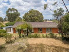  97 Heathersleigh Road  Armidale NSW 2350 $499,000 'Glen Jada' is well located, positioned just 11km from Armidale's CBD sitting on 2.54ha of land. There are many hidden features to this property. The main residence offers a functional 5 bedroom, 2 bathroom brick and tile design. The spacious master bedroom is complete with an ensuite plus significant wardrobe storage. All bedrooms are fitted with recently laid carpets and built in wardrobes. The kitchen offers a large walk in pantry and feeds to both the dining and lounge rooms which flow through to the northern side of the home where a large fully enclosed sun room can be found. Winter warmth is assured both passively and via a recently installed modern slow combustion wood heater. Adjacent to the main home is a fully self contained spacious one bedroom Granny Flat. The flat offers open plan dining and lounge rooms plus a generous size bedroom. The living areas are carpeted with the kitchen and laundry areas tiled. Reverse cycle air conditioning ensures comfort for all seasons. Both dwellings benefit from a well fenced house yard designed to keep small dogs. The house yard features established trees and shrubs plus a large veggie garden. There is a bore on the property which is utilised for the supply of garden water. Domestic water is supplied via roof catchment with approximately 70,000 litres of tank storage. The outbuildings include numerous garden and tool sheds plus two car sheds and a recently completed fox proof, large scale chicken run. The acreage offers basalt soils, flat terrain and is considered ideal for running horses and small livestock or more expansive vegetable and fruit production. In conjunction with Ray White Rural Guyra/Armidale. Disclaimer: While care has been taken in the preparation of these particulars the agent is relying on information provided by a third party and has not checked the accuracy of the information. Ray White Armidale cannot guarantee the accuracy of information collected and no responsibility is accepted for the whole or any part. Interested parties are advised to make their own enquiries and satisfy themselves in all respects. 