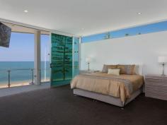  115 Margate Pde, Margate -  Waterfront Properties Redcliffe ULTIMATE IN LUXURY LIVING This luxurious masterpiece will impress from start to finish. Boasting the perfect location, this architecturally designed and built home offers outstanding vistas and a waterfront lifestyle second to none. Properties of this calibre and location are rarely offered to the market. Move in and enjoy being surrounded by the absolute quality this immaculate residence offers…… not to mention waking to the sound of waves rolling gently onto the foreshore, sunrise peeping over the horizon and the moon shimmering across the bay at the close of play …….. just amazing. The user-friendly design features high ceilings and spacious light filled rooms with a floor plan that spans 3 levels of designer brilliance, this home ticks every box. Providing the ultimate in executive entertainment with a full wet bar and pool room flowing onto the extensive deck, where you will spend hours enjoying the endless views across the bay or alternatively, move to the sanctuary of the media room to choose from a full range of entertainment options. The huge feature packed gourmet kitchen leaves nothing to be desired. Including a massive island bench ideally positioned to take in the glorious bay views. Miele appliances including dishwasher, 900mm induction cook top, steam oven, plate warmer and microwave with an abundance of storage. The third level master bedroom epitomises luxury with extensive bay vista pouring into the room, massive open area ensuite and WIR. A further three double sized bedrooms, all with large WIRs, a second ensuite, main 2 way bathroom/ensuite and powder room provides for all the family and guests with ease. Massive 674sqm of luxuriously appointed living Additional Features: - Huge home office - The basement level has space for all the toys, including up to 8 car spaces with large storage room, second laundry and powder room. - Very Low maintenance, fully landscaped block with a 23,000 litre inground, concrete water tank. - Ducted air throughout - Polished timber staircases - Huge well appointed laundry - Vacuum maid - Intercom - Security alarm system - Water and power to all balconies - Efficient Heat pump hot water system - Provision, plans and approval for lift and pool. From this gorgeous home, stroll in either direction for kilometres without leaving the sandy shores of the bay. Perched on arguably the premium strip of beach on the Peninsula, this home is simply …….the ultimate in luxury waterfront living. Property Code: 590 