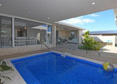  221 Long Street Pialba QLD 4655 $719,000 If you are looking close (100 metres) to the beach and all from the comfort of your very own resort style home – this is your home. A brand new 3 bedroom home plus study, plus pool bar room with powder room, media room, butler pantry is one of a kind! This beautiful 289m2 home (built on a 603m2 block in Ocean Blue Estate) incorporates spacious outdoor living with relaxation essentials like the pool bar, under roof heated plunge swimming pool with spa jets. The wonders of this home do not stop with the great outdoor living and new technologies. The internal floor plan is designed to achieve the resort-style feel with all bedrooms and living area having a view of the pool. All bedrooms have walk-in robes for that extravagant feel to every room. The media room is the first room off the formal entrance area and opening the door reveals an awesome display of workmanship and attention to detail. Our kitchen features all the latest in trends including under bench lighting and our feature tile splashback is just that extra something special and don’t forget the home also has a built in BBQ area in the alfresco making cooking for friends & family easier than ever! Modern speakers throughout the home including the pool and bar area – accessible by Bluetooth using your smart phone music playlists! This home features ducted air conditioning, ducted vacuum system & solar hot water & solar electricity. Another great design feature is the dual access from the garage to the pantry or the laundry – so convenient after shopping you can easily drop your groceries off in the butler’s pantry. 