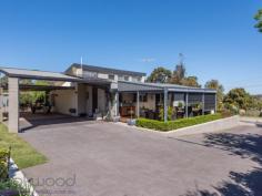  23 Wortley Road Greenmount Greenmount WA 6056 $499,000 Discover how it feels when everything is “just right”. Hidden behind an established garden and set towards the end of a cul-de-sac, this 4 bedroom, 2 bathroom, plus study brick and iron home has an aura of understated chic and oh-so-easy living. Impeccably presented indoors and out, raked ceilings with exposed beams and highlight windows deliver light, airy spaces while honey-toned timber and gold-flecked granite create an instant welcome. A decked alfresco entertaining area edged with manicured gardens and a water feature expand the functional living space and deliver a home that is family-friendly and move-in ready. 4 bed 2 bath plus study 1977-built brick & iron Open plan kitchen/meals Airy sunken lounge room Quality windows & blinds Timber floors & cabinets Easy indoor-outdoor flow 5 Kw array solar panels Impeccable 855 sqm block Close airport and Midland The sense of entering a private retreat is immediate as you make your way up the paved driveway to the welcoming front porch and stylish alfresco entertaining deck. A faultless exterior, timeless design and quality fixtures ensure this property will elicit a long, relaxing exhale and the realisation you have found a home that is “just right”. Garden views, a calming water feature and city glimpses give the covered deck an irresistible pull and lead you into the light-filled, open plan kitchen/meals and sunken lounge. High ceilings with exposed beams and German-engineered, double-glazed windows highlight the solid style credentials of this memorable property. Louvered, highlight windows add to the luminosity of the gold-flecked granite benchtops and Anigre timber cabinetry. A 5-burner hob, 900 mm oven, dishwasher and large pantry create a kitchen that is as functional as it is stylish. Tall windows fill the sunken lounge/family room with garden views and create a space that feels both cozy and spacious. A built-in bookcase and timber floors add to the sense of comfort and style, while high ceilings create a feeling of openness. The main bedroom and adjoining office are arranged at the front of the home and open to a private pergola-covered terrace. The main suite features a large built-in robe and ensuite with shower, vanity and W.C. Three good-sized junior bedrooms – one with a surprisingly large walk-in robe, two with built-ins – share a family bathroom. A walk-through laundry leads to the rear of the home where a large carport – with space for 4 cars – and a series of raised garden beds bordered by two garden sheds. Grey paving edged with a tidy lawn wraps back to the alfresco deck to expand the functional outdoor space. The spacious deck, surrounded by a low clipped hedge, offers ample space for both seating and dining. Overhead fans, an elevated position and city glimpses create a relaxed mood while direct access to the kitchen delivers seamless indoor-outdoor living. Situated within easy reach of the services and amenities of Midland, the beauty and outdoor adventures of the Perth Hills this home is a short drive from the airport and offers access to a choice of schools. Don’t hesitate, come and discover what it’s like when everything is “just right”... 