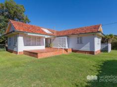  33 SYDNEY STREET, Redcliffe -  Waterfront Properties Redcliffe FABULOUS FAMILY HOME Do you want to purchase a spacious family home, opposite family day care and a swimming pool? Could you restore this home to its former glory? Situated on a level block with wide frontage this one owner family home is available to an astute buyer looking for a project to which they can value and with the potential to land back for the future. Features 1072m2 of Land - with 4 bedroom house - Zoned Urban - (7 Levels) - 300m to Redcliffe Beach - minutes to Shopping Centre and eateries - opposite Memorial swimming pool - opposite Anne Shearer Day Care and Kindergarten - Short stroll to public transport & all amenities This site, due to its position and zoning is suitable for several types of development. Call Mary on 0438 054 227 for more information! 