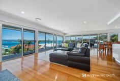  2 Opal Close Swansea Heads NSW 2281 $1,790,000-$1,969,000 If this isn't paradise, we know where they got their ideas from. Nestled between pristine Swansea Channel and one of the prettiest coastlines NSW has to offer, this home is literally 100m from swimming & fishing, or 500m from sensational surf at Hams Beach. Step inside to the cool elegance of coastal living and enjoy a lifestyle envied by all. The lower level has a modern, self contained guest suite, complete with kitchen, laundry and living spaces. Enjoy stunning views from the deck, living area and bedroom or wander to the pool and have a refreshing dip while admiring the view. The main residence features 180 degree panoramic views framed by floor to ceiling glass windows and doors from the open plan living area. You will not miss any of the action on Swansea Channel, or look across the channel to 9 Mile beach to check the surf! Beautiful by day and by night, watch the lights twinkle across the water from nearby Swansea. Entertaining is a breeze in this stunning home, with the chic kitchen right in the centre of the action. Timeless white cabinets and stone bench tops. A big island bench with breakfast bar will keep the chef involved in the party. Although there'll never be a shortage of willing guests, this home is perfect for quiet evenings and family get togethers. There are three bedrooms on this level, all with built-ins, ceiling fans & ducted air. Two of the bedrooms enjoy stunning views through sliding glass doors ... step out onto the balcony ... what a way to start your day! The Master suite features a gorgeous ensuite and big walk-in robe as well as a huge built-in wardrobe. Living is easy here! Swansea Heads peninsular only has around 500 homes, yet just 2.5km away sits the Caves Beach Resort, with restaurant and entertainment. Swansea CBD shopping is just a 5 min drive away ... that's if you don't want to go by boat or SUP! The home handy person will enjoy a separate, massive workshed with bench. There's also a huge under house storage area for push bikes, SUPs and Kayaks. The single garage is ideal for Jetski's, motorbike or smaller boats and the double garage will house whatever else you have! There are 16 solar panels fitted, along with ducted vacuum and an auto sprinkler system for lawns & gardens. Imagine family gatherings around the pool, or watching the sky change colour at the end of the day from your balcony overlooking the cool aqua waters of Swansea Channel. Yes! Living is easy here! Take the tour of this stunning home to see all that it has to offer! KEY FEATURES: Air Conditioning Built-In Wardrobes Garden Secure Parking... 