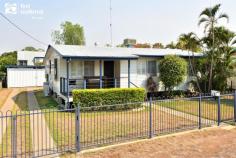  1 Manton Street Biloela QLD 4715 $229,000 A comfortable home made perfectly for an expanding family is ready and waiting for its new owners. The spacious step-down rumpus room is fully enclosed and includes laundry and second toilet. It’s a great place for kids (young and “not so young”) to make a ruckus without creating mayhem in the main living area. There are three bedrooms with built-in robes and an attractively renovated bathroom, a very tidy kitchen with plenty of built-in cupboards and dining room separated from the kitchen by a breakfast bar, on cork flooring. Windows boast shutters and some security screens, there are two split system air-conditioners and an evaporative cooling system ducted throughout. A small rainwater tank is located at the rear of the home, and a double lock up shed for secure car accommodation has concrete drive-in paths. It is also fully fenced with a front deck at the entrance. Presented by the current owners, this home has been very well maintained and its new owners can confidently move in and enjoy this appealing property. Priced to sell, your personal inspection can be arranged by calling Amanda or Ross at First National Biloela. 