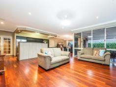  62 BODDINGTON CIRCUIT Dianella WA 6059 $849,900 You can save time and money by owning this home that ticks all the boxes for you & your family! Only three houses up the street from St Andrews Grammar private school catering from K to year 12. So you can walk them to & from school until they want to walk by themselves. We personally recommend this school as both our daughter & son went to school here and both have grown up to be well respected individuals on their way as successful as young adults. And after your children have grown up, this home is set up for a lock up and leave lifestyle for the rest of your life, so this is perfect as your “forever home”. Everyone gets their space. You can retreat up front with your own living/ theatre room, king-sized master bedroom with walk through his and her robes into the ensuite with 2 bowl vanity unit, shower and wc. A wing off to the rear side of the home has a wide passage with three double linen cupboards between it and the adjoining living areas with three good sized bedrooms, all with built in robes serviced by bathroom, wc and the laundry. This means your children are able to sleep easy and all can retreat to their own space. Greeting your guests is an impressive entrance hall which has recessed ceiling and recessed wall space for your artwork. Polished hardwood floors flow through French doors into the sweepingly big open planned casual living space, where the impressive Masters kitchen newly incorporates Schweigen exhaust Range hood direct to outside, stainless steel dishwasher, induction cook top, double oven and microwave, Caesar Stone bench tops with waterfall ends and privacy counter, appliance, pantry and with a ceiling bulkhead over, you will love cooking and serving from here and you can be a part of the goings on from here. The polished hard wood floors spread out through this area and into the dining and family rooms where a wall of windows and doors opens out to the massive outdoor alfresco where nearly the entire backyard has been paved, connecting the rear corner under cover bar area and custom built artistically created metal pergola and back-lit hedging, panels and water features. Love entertaining all year round? There is so much combined space inside and outside which will cater for just private barbecues or big parties where all your family and friends can get together for all ages. If you love sports, then call the team over to take in 2020 cricket and football. Stack the eskies and there’s TV points inside and outside so you won’t miss anything. This home is easy care and has every conceivable built in modern convenience, with ducted air conditioning, polished hardwood floors through most living areas, ceiling fans throughout and solar panels. There is nothing to do but move your family and belongings in and you will be proud to come home to this wonderful St Andrews Estate state lifestyle!. So convenient, with walking distance to local parks, playgrounds, bus route to the city, freeway access around the corner north and south east and west, a choice of many major shopping centres and schools private and public. The owners have purchased elsewhere and are ready to move so you can move straight in if you’re quick enough before the school year or close enough. 