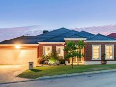  62 BODDINGTON CIRCUIT Dianella WA 6059 $849,900 You can save time and money by owning this home that ticks all the boxes for you & your family! Only three houses up the street from St Andrews Grammar private school catering from K to year 12. So you can walk them to & from school until they want to walk by themselves. We personally recommend this school as both our daughter & son went to school here and both have grown up to be well respected individuals on their way as successful as young adults. And after your children have grown up, this home is set up for a lock up and leave lifestyle for the rest of your life, so this is perfect as your “forever home”. Everyone gets their space. You can retreat up front with your own living/ theatre room, king-sized master bedroom with walk through his and her robes into the ensuite with 2 bowl vanity unit, shower and wc. A wing off to the rear side of the home has a wide passage with three double linen cupboards between it and the adjoining living areas with three good sized bedrooms, all with built in robes serviced by bathroom, wc and the laundry. This means your children are able to sleep easy and all can retreat to their own space. Greeting your guests is an impressive entrance hall which has recessed ceiling and recessed wall space for your artwork. Polished hardwood floors flow through French doors into the sweepingly big open planned casual living space, where the impressive Masters kitchen newly incorporates Schweigen exhaust Range hood direct to outside, stainless steel dishwasher, induction cook top, double oven and microwave, Caesar Stone bench tops with waterfall ends and privacy counter, appliance, pantry and with a ceiling bulkhead over, you will love cooking and serving from here and you can be a part of the goings on from here. The polished hard wood floors spread out through this area and into the dining and family rooms where a wall of windows and doors opens out to the massive outdoor alfresco where nearly the entire backyard has been paved, connecting the rear corner under cover bar area and custom built artistically created metal pergola and back-lit hedging, panels and water features. Love entertaining all year round? There is so much combined space inside and outside which will cater for just private barbecues or big parties where all your family and friends can get together for all ages. If you love sports, then call the team over to take in 2020 cricket and football. Stack the eskies and there’s TV points inside and outside so you won’t miss anything. This home is easy care and has every conceivable built in modern convenience, with ducted air conditioning, polished hardwood floors through most living areas, ceiling fans throughout and solar panels. There is nothing to do but move your family and belongings in and you will be proud to come home to this wonderful St Andrews Estate state lifestyle!. So convenient, with walking distance to local parks, playgrounds, bus route to the city, freeway access around the corner north and south east and west, a choice of many major shopping centres and schools private and public. The owners have purchased elsewhere and are ready to move so you can move straight in if you’re quick enough before the school year or close enough. 