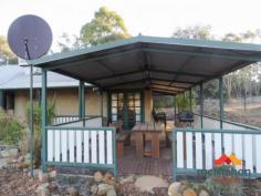  75 MISTLETOE VIEW CROSSMAN WA 6390 $499,950 We are excited to present to you an amazing opportunity to own this 3 bedroom Cottage, which will bring many joyful moments and create lasting happy memories for the lucky buyer. Sitting on a large 19.72Ha block this location is Peaceful with spectacular views and makes it a perfect place to unwind and slow down. Key features include: • Good size kitchen/dining/living area with heater and Jarrah floor • Large and bright updated kitchen with lots of storage and dishwasher • Master bedroom with French door entry to the patio • Large minor bedrooms • Renovated bathroom • Wrap around verandah with patio extension • Beautiful and reticulated garden with olives, nectarines, almond, mandarin and many more • Water tank with estimated capacity of 100’000l • 12m x 7.5m water dam • Large workshop with covered parking and rainwater tank, horse and chicken enclosure • 4.5kW Solar panels.. 
