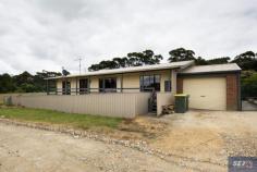  2B Mill St Toora VIC 3962 $420,000 Just a short walk to the centre of town, this brick and cedar home is perfectly positioned to take full advantage of the lovely outlook over the adjoining acreage to the creek and hills in the distance. Set on an easy care block of approx 510m2 there are verandahs on both sides to sit back and watch the world go by no matter the season. Surprisingly spacious inside with abundant natural light and large areas of glass. Living room with raked ceiling and timber feature wall. Modern as new kitchen with stainless appliances and breakfast bar to meals area and family room with RC/AC and new wood heater – large enough to warm to entire home. There are three spacious fitted bedrooms, central main bathroom with bath, separate shower recess and a 2 way loo. Large laundry with external access. LU garage plus room for a boat/van. Fully fenced garden safe for littlies or pets. Come and discover the delights of this historic township just 2.5kms from the coast with so much to offer for full time residents or holiday users. Heated pool, Great Southern Rail Trail, bowling green, historic hotel, shopping centre, medical centre, post office, primary school. 