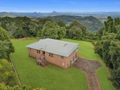  15 ALFS ROAD BALD KNOB QLD 4552 Situated high on Bald Knob is this beautifully built 3-bedroom brick home. Bald knob is just minutes to the townships of Maleny and Montville and is perfectly positioned for those looking to enjoy the best of the Sunshine Coast Beaches, the Hinterland itself and further beyond to Brisbane. With stunning rural and mountain views this home is looking for a new family, and with its neutral canvas the opportunities are endless. Property Features: - 3 good sized bedrooms - 2 bathrooms - 2,000m2 block - Open plan living - Large dining kitchen with wood fireplace - Large verandah to take in the stunning views - Polished blackbutt floors throughout - Huge garage and workshop with vehicle pit and 3.4m high ceilings - Large storeroom and laundry Boasting a cavernous garage and workshop; it's perfect for the home mechanic or there may be the opportunity to convert it for dual living perfection. Now is your time to secure views and a Hinterland lifestyle that just can't be had anywhere else. 