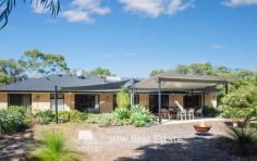  32 Kangaroo Parade Yallingup WA 6282 $1,300,000 to $1,400,000 Situated just a three minute drive from both Smiths and Yallingup beaches, this four bedroom, two bathroom, solar passive, brick and Colorbond home is tucked away on 2.7 acres of peppermint, banksia and redgum bushland. Just a short walk to Studio Bistro and Little Fish restaurants and a two minute drive to Yallingup General Store and Caves House Hotel. This versatile four bedroom home has an open plan living, kitchen, dining area with raised ceilings and a slow combustion wood heater. A generous separate lounge area has an open fireplace. All rooms have bushland outlooks. The living areas and main bedroom face north for winter sun and open out onto a freestanding alfresco area. The home also has a large games room/workshop accessed from the double garage or verandah. The succulent gardens are low maintenance. The bushland has stunning wildflowers in spring including orchids. The home has a fully reticulated vegetable garden and established fruit trees. Water for gardens is supplied by a bore. There is plenty of room for visitor’s cars, caravans and tents. If you are chasing a secluded home or holiday house on acreage close enough to the beach for a morning swim, surf check or evening sunset walk then this is the property for you. Additional Features: * 1.1022ha (approximately 2.7 acres) * 2 x split system air conditioners (living area and games room) * Solar hot water system with electric hot water booster * 13 panel solar system * Huge rain water tank * Bore with self-filling holding tank * 3 huge shade sails between house and freestanding alfresco area * 900mm rangehood, gas hotplate and 600mm oven * Large walk-in pantry * 2002 brick and Colorbond construction * Room to add sheds, granny flat or extensions (subject to approval) * Fenced vegetable gardens * Established fruit trees * Garden shed * Shade house For further information or to arrange inspection please contact your South West Sales Representative Ben Jecks on 0408 545 304 or ben@jmwrealestate.com.au 