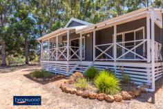  572 Berry Rd Gidgegannup WA 6083 $1.1M TO $1.2M This lovely equestrian facility, set in the rolling hills of Gidgegannup, is the dream for any equine enthusiast. Hidden on 50 acres, behind an automatic gate, the 3-bedroom, 1-bathroom cottage boasts front and rear verandahs overlooking stunning Gidgegannup bushland and sunsets. Set up as a family home, agistment and riding centre, this property is ideally situated 5 minutes from Gidgegannup township, 25 minutes from Midland, and the Perth CBD is under an hour’s drive. • 	 3-bed character cottage • 	 7 stall barn & secure tack • 	 Feed room & wash bay • 	 Bayco electric fencing • 	 Auto water to paddocks • 	 Day yards w lge shelters • 	 Floodlit jump arena • 	 Round yard dressage arena • 	 Drive-through hay shed • 	 Hi-yield bore winter dams Rolling pastures, a charming, renovated cottage, and a separate 2-room studio set the scene for a picture-perfect horse-centred lifestyle. Hidden on 50-acres, behind an automatic gate, the 3-bedroom, 1-bathroom home boasts front and rear verandahs and a fenced backyard. Boasting everything for the equine enthusiast or professional: Large paddocks with automatic water and safe electric fencing, day yards with large shelters, numerous sheds and a drive-through hay shed with undercover float parking. A 7-stall barn with a large mare and foal stall, a secure tack and feed room and a wash bay. The gently rolling landscape incorporates two winter dams and a high-yield bore supplying water to the paddocks. There is a floodlit jump arena, a flat arena, and a 20-metre round yard. Established gum trees provide shade across the property. The cottage has been renovated with a soft, neutral palette of grey and white and features richly hued jarrah floors in the central living zone. An open plan kitchen/family room with double doors to the front verandah delivers indoor-outdoor living against panoramic views of gently rolling paddocks, a neighbouring dam, and sunsets. Each bedroom enjoys rural views; two are fitted with a ceiling fan and built-in robes.  The main bedroom enjoys direct access to the front verandah to provide an ideal setting for a quiet morning coffee as you plan the day’s activities. A renovated self-contained 2-room studio offers an additional flexible space – ideal as a creative workspace. This property has the infrastructure to ensure the best experience for horse and rider. An idyllic setting, ample space for horses, gear, and activities make this an excellent property for equine enthusiasts or those searching for a tree change. Don’t hesitate at the opportunity to take possession of this lifestyle property in a breathtaking setting only minutes from the friendly township of Gidgegannup. To arrange an inspection of this property, call Cheryl New on 0439 961 192. 