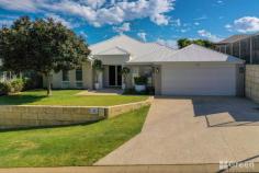  39 Richview Ramble Wannanup WA 6210 $700,000 Have you been searching for ‘the one’ but can’t seem to find it? Look no further, as this home is something special. It is my pleasure to present to the market 39 Richview Ramble, in the coastal suburb of Wannanup. This home oozes style and class from every angle, and, set on a 582sqm block, the current owners have taken careful consideration in planning both the layout and positioning of this home, so as it maximises the use of space. From the stunning oak veneer timber flooring and feature lighting, to the sparkling Salt-Magnesium Mineral below ground pool, you won’t be disappointed! FEATURES • 4-bedroom x 2-bathroom home on 582sqm level block • Master Suite includes His & Hers WIR, Ensuite with Double Vanity and Shower • Three minor bedrooms are all Queen Size, with BIR • Sparkling 8m x 3m Mineral Fibreglass Swimming Pool • Double garage with extra length PLUS workshop and storage to the side, all set on polished concrete. • Decked Alfresco Entertainment area, with extra Travertine Paved lounging area • Manicured, easycare Gardens • Separate Cinematic Theatre/Games Room with feature ceiling • Laundry with WI linen cupboard • Open plan Kitchen/Living/Dining overlooking the garden and pool area • Kitchen features Essastone benchtops, 900mm Stainless Steel Oven and cook top, DW, Appliance cupboard, Soft close drawers, and large fridge recess with plumbing for convenient cold water & ice • Main bathroom comes with Spa Bath & Separate W/C • Built in 2008 by Scott Park Homes. 
