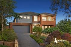  8 Classic Dr Mooroolbark VIC 3138 $1,150,000 - $1,250,000 Dazzling with its modern facade, this attractive home promises an extraordinary family lifestyle. Natural light fills the interior, introduced by a spacious lounge room with elevated garden views, leading through to a multi-purpose room that could be used as a study, playroom or additional living. Step through to an open plan family room, dining zone and a stylish kitchen appointed with stainless-steel appliances, a walk-in pantry and terrific storage space. All bedrooms are located upstairs, including the indulgently spacious master suite boasting a walk-through dressing room and a luxe ensuite with an oversized rain shower, dual basin vanity and a private Juliet balcony to unwind or read a book. A comfortable retreat enjoys peaceful Dandenong Ranges views during the day and colourful sunsets at dusk. Ready for entertaining, the paved alfresco zone with a sun awning provides a haven for casual meals outdoors, overlooking the well-maintained backyard with a lush lawn area for the kids and family pets. Amongst the highlights are ducted heating/vacuuming, evaporative cooling, quality timber floors, garden shed, water tank, dual driveway access to a double auto garage with internal access and off-street parking for visitors and friends. In a family-friendly neighbourhood, the home is positioned a short walk from Mooroolbark East Primary School and Billanook Secondary College, with proximity to Mooroolbark Village and Train Station, Box Hill TAFE Lilydale campus, Lillydale Lake and popular Shopping Centre. 