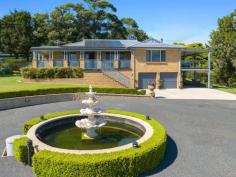  2a David Smith Place Kiama Heights NSW 2533 $1,960,000 - $2,150,000 Situated on almost one acre of land with a private aspect from surrounding properties and enjoying ocean and rural views, this large home invites a prestigious way of living in the beloved coastal town of Kiama. Before entering the property, the outdoor features of this residence are a staple in itself. With first impressions of this large lot residential property influenced by a gated driveway, highly maintained lawns, and a feature water fountain, the home presents unlike many others with a sense of premium exclusivity. Park your caravan under the freestanding shelter, park multiple cars in the port cochere, two-car garage or under the carport. With well-established veggie patches, flourishing gardens, and a well-looked-after swingset, there is plenty to keep kids and adults entertained. Upon entering the property you are greeted with elevated 9ft ceilings and polished tile flooring. The home comprises five bedrooms with the master suite hosting a walk-in wardrobe and modernised ensuite, another two bathrooms, a dining area that flows into the oversized living room, a kitchen with modern appliances and Caesarstone benchtops, and the entertainers dream with a large verandah, perfect for hosting friends and family. Downstairs you will find the tinkerers retreat, complete with a large workshop, two-car garage and bathroom. Offering multiple areas to either work from home, host friends and family, lounge in the oversized family room or outdoor space, or enjoy family picnics in the yard, this home truly caters to your needs. This home is sure to entice those who are looking for that perfect family home, investment or holiday home. 