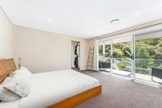  4/14 Station Street Stanwell Park NSW 2508 $1,850,000 - $1,950,000 Looking for a coastal lifestyle that caters to your every need? Look no further than this stunning four-bedroom, freestanding residence located just moments from Stanwell Park beach, shops, and public transport. Designed with low maintenance living in mind, this property offers spacious and versatile living with ample room to move throughout. As you step inside, you'll be greeted by a light-filled, open plan living area that takes advantage of the north-facing aspect, flooding the home and backyard with natural light all day long. This home stands alone, ensuring peace and privacy, and backs onto a large reserve, providing direct access to the parklands and meters away to the tennis courts ( yearly membership of just $60 per year) and an uninterrupted view of the national park. Featuring four large bedrooms, all with built-in wardrobes, the master bedroom boasts its own ensuite, private balcony, and walk-in wardrobe. The fully fenced and level backyard is perfect for kids to play safely, while you can supervise from the overlooking kitchen. The large, oversized double garage is perfect for big 4x4 owners or home gym enthusiasts with internal access completes this home's package. The location is unbeatable! Just steps away from the family-friendly parklands, and a few more steps will have you on the pristine Stanwell Park Beach. The recently upgraded local primary school is a walk across the street, situated approx 50m from the home, making it an ideal location for families with children. Within minutes walk, you'll find cafes, restaurants, and an art gallery. Stanwell Park is situated approximately 1 hour South of Sydney CBD and approximately 30 minutes North of Wollongong CBD, making it a convenient location for commuters. Embrace the low maintenance coastal lifestyle and all that comes with it, from swimming, surfing, tennis, fishing, and bushwalking to hang gliding and family picnics in popular parklands, all available only moments from your doorstep. 