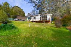  15 William St Bundanoon NSW 2578 $895,000 Charming, compact cottage with a touch of quirky 1960s, set in a highly sought after location, the gorgeous bank of windows to the north ensure the living, dining and kitchen space is bathed in natural light. The deep front deck off the entry offers extra living / entertaining in the warmer months. A gorgeous property at a great price in the village of Bundanoon. High points Excellent northern aspect ensuring a warm sun filled home via the Magnetite retrofit double glazing system The quaint kitchen has been fully renovated with space saver dishwasher, stone benches and breakfast bar The main bath has also been fully renovated with shower, wc and timber vanity plus the laundry offers a second wc A very flexible floorplan, currently configured as a two bedroom residence but the 3rd utilities room would make a great work from home space, guest accommodation or artist’s studio Adding to the charm of the cottage are the high raked ceilings on entry and throughout the living, dining and kitchen space which also offers rear access to the paved terrace area perfect for further entertaining and BBQing Externally the home offers a free standing near new garden shed, plus smaller storage / bike shed and relatively good fencing, with a single carport to the front and plenty of off street parking Heating and cooling is via the gas ducted heater + split system a/c and further enhanced via the double glazed windows, new roof and insulation The park like grounds are low maintenance with sweeping lawn areas, hedging, some garden beds and planting to the streetscape ensuring further privacy Fabulous location offering an easy stroll to the village and all it has to offer 