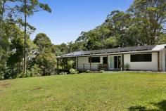  767 Trees Road Currumbin Valley QLD 4223 $1,995,000 10 Acre Natural Wonderland With Vast Coastline Views Dreaming of a tree change? Swap urban chaos for rural tranquillity and retreat to a 10 acre natural wonderland in Tallebudgera Valley. Hovering 300m above sea level and basking in spectacular views, a rolling tapestry of greenery sprawls out to meet the magnificent coastline, with the Pacific Ocean sparkling on the distant horizon. Co-existing in harmony with its surrounds is a charming mud brick home that speaks to the simplicity of life here among the treetops. Accessed by a newly sealed bitumen driveway, the exposed rock flooring, timber panelled walls and louvred windows reinforce the character of the unspoilt surrounds, while also keeping it naturally cool. Raked ceilings with timber beams and a feature mud brick wall enhance the earthy charisma in the lounge room, while the kitchen has been modernised with sleek white cabinetry and new appliances to complement the original stove. Two bedrooms and one bathroom grace the floorplan too, with the master bedroom offering enhanced peace and privacy via a private entry. A second bedroom features a built-in robe and handy direct access to a light-filled bathroom/laundry. There's ample room to relax on the outdoor deck that wraps around the side and the rear of the home, with flat grazing areas and a summer creek meandering through this lush bushland paradise as well. The 30kW solar system and a 50,000L water tank cater to an off-grid lifestyle, plus the home hosts a new and insulated 4-bay carport. There's even a cleared section overlooking Springbrook Mountain and Currumbin Valley, ready for you to build a second residence. Supremely peaceful and private, this idyllic oasis is conveniently just 11 minute's drive from Tallebudgera State School and shops/amenities (approx.), with beautiful beaches and coastal cafes of Palm Beach and Burleigh beckoning in 20 minutes (approx.). Experience the serenity, seclusion and enticing potential firsthand – arrange your inspection today. Main House Features 10 acre parcel of paradise with vast views stretching towards the coast Completely off-grid lifestyle on offer Charming mud brick and timber construction home Exposed rock flooring and louvre windows throughout Modernised kitchen with dual sink, 4 burner gas cooktop and oven, built-in pantry, original stove/oven and a 3-seater breakfast bar overlooking deck Lounge beneath 3.2m raked ceilings with exposed timber beams plus feature mud brick wall, wood fireplace, built-in cabinetry and sound system Master bedroom with louvre windows, storage room and private entry Bedroom 2 with built-in robe and access to light-filled bathroom/laundry Outdoor entertaining deck which wraps around half the home Other Features Cleared section for another building pad overlooking Springbrook Mountain and Currumbin Valley 30kW solar system with 60 panels Gas hot water New insulated four-bay carport Woodshed Shed with work bench and storage Flat grazing areas throughout the property Summer creek 50,000L water tank Located 300m above sea level Bitumen driveway, lined by a new concrete/rock retaining wall at the end section Location Approx. 11 mins to Tallebudgera State School and shops/amenities Approx. 15 mins to St. Andrew's Lutheran College Approx. 18 mins to The Pines, Elanora Approx. 19 mins to Palm Beach Approx. 20 mins to Burleigh Heads Approx. 20 mins to Currumbin Beach Approx. 26 mins to Gold Coast Airport Approx. 40 mins to Surfers Paradise 