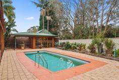  33 Foothills Road Mount Ousley NSW 2519 $1,150,000 The epitome of charming, this character-filled residence invokes a feeling of warmth that'll make you feel at home instantly. Positioned in the heart of Mount Ousley on a quiet street, it features a resort-style pool and cabana surrounded by lush landscaping that will surely make a splash with every member of your family. Ticking all the right boxes, this light-filled home offers a commanding street presence, full-length balconies that take advantage of the picturesque escarpment views, ducted air-conditioning, original Baltic floorboards and a second living room that can be easily transformed into a teenage retreat or theatre room. Renovators, investors, empty-nesters and first-home buyers alike will enjoy making this home their own, with plenty of potential to breathe new life into the property while maintaining its unique personality. Features Landscaped yard, pool + alfresco cabana Additional living room to suit your lifestyle Enjoy complete privacy, full security system Lock up garage, original Baltic floorboards Easy access to schools + public transport 