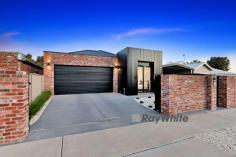  630 Koorlong Avenue Irymple VIC 3498 $749,000 - $823,000 Sales Agent and Marketing Specialist, Katrina Wootton of Ray White Mildura welcomes to this unique, industrial-inspired residence designed for those who appreciate a refined, contemporary lifestyle. This luxurious 3-bedroom, 2-bathroom home offers the perfect blend of sophistication and functionality, making it the ideal haven for professionals, young couples, small families, singles, retirees and first home buyers alike. Upon entering, be captivated by the polished exposed aggregate concrete flooring, high square set ceilings and impressive study nook, secluded behind charming barn doors. The heart of the home is a spacious, open plan kitchen, dining, and living room, complete with stunning a Venetian plaster feature wall. The kitchen itself boasts a magnificent intense white Caeser-stone waterfall island benchtop, induction cooktop with integrated range hood, a chic pendant light, and a generously-sized butler's pantry with sink and dishwasher, ensuring you have ample space to store and prepare culinary delights. The master suite is truly a retreat, offering access to the rear yard, an open walk-in robe and a sleek ensuite with a walk-in shower. Reverse cycle heating and cooling ensure year-round comfort, while the large sliding stacker door invites you to step out into the alfresco area, complete with a built-in fireplace and barbecue - perfect for entertaining or simply relaxing in your own private sanctuary. A 5.2kW solar system, automatic front gates for added security, a double garage, and a low maintenance yard round out the features of this remarkable property. Set on a 395 square metre block, this elegant townhouse has it all, combining an elegant industrial aesthetic with the practicality and convenience modern living demands. Don't miss the opportunity to make this exceptional residence your own. Act quickly and secure a viewing today! 